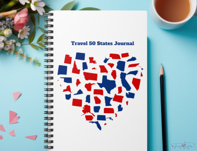 heart outline with red and blue United States outlines. titled travel 50 states journal. white cover, spiral bound notebook.